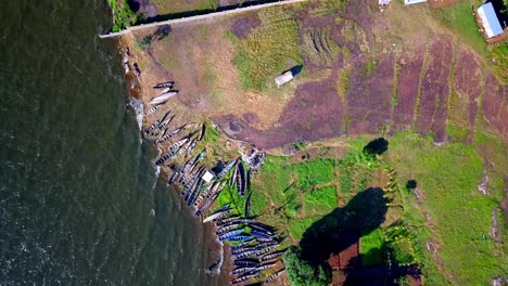 Top-View-Of-Illegal-Fishing-Boats-Confiscated-By-Police-On-The-Shores-Of-Lake-Victoria,-Uganda