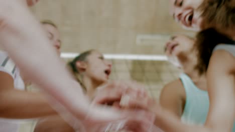 hands together before volleyball game begins - encouraging team spirit