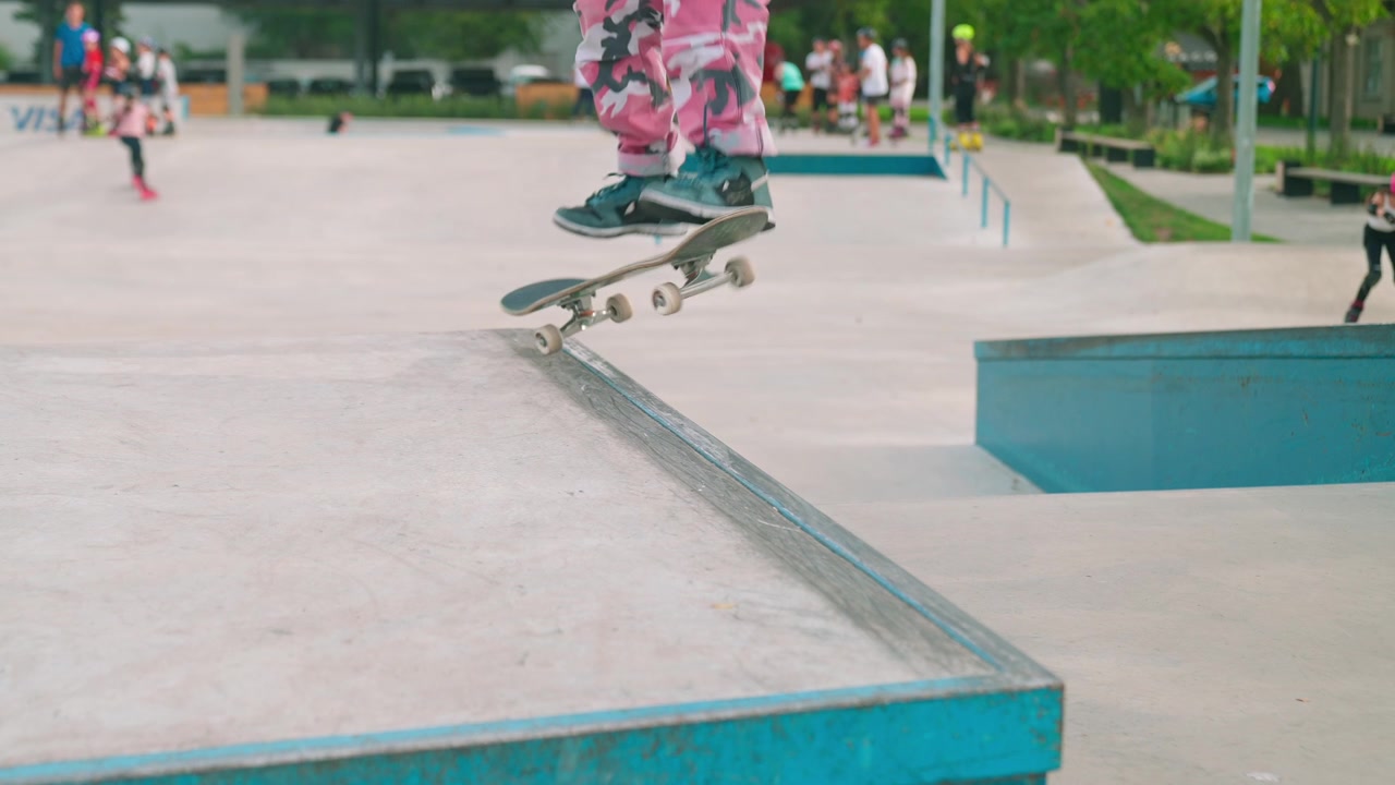 Young Skateboarder Performing a Grind Trick on a Ledge in a Skatepark