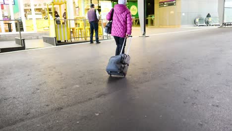 woman with luggage at airport