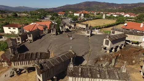 people visiting old graniers in village of soajo, portugal