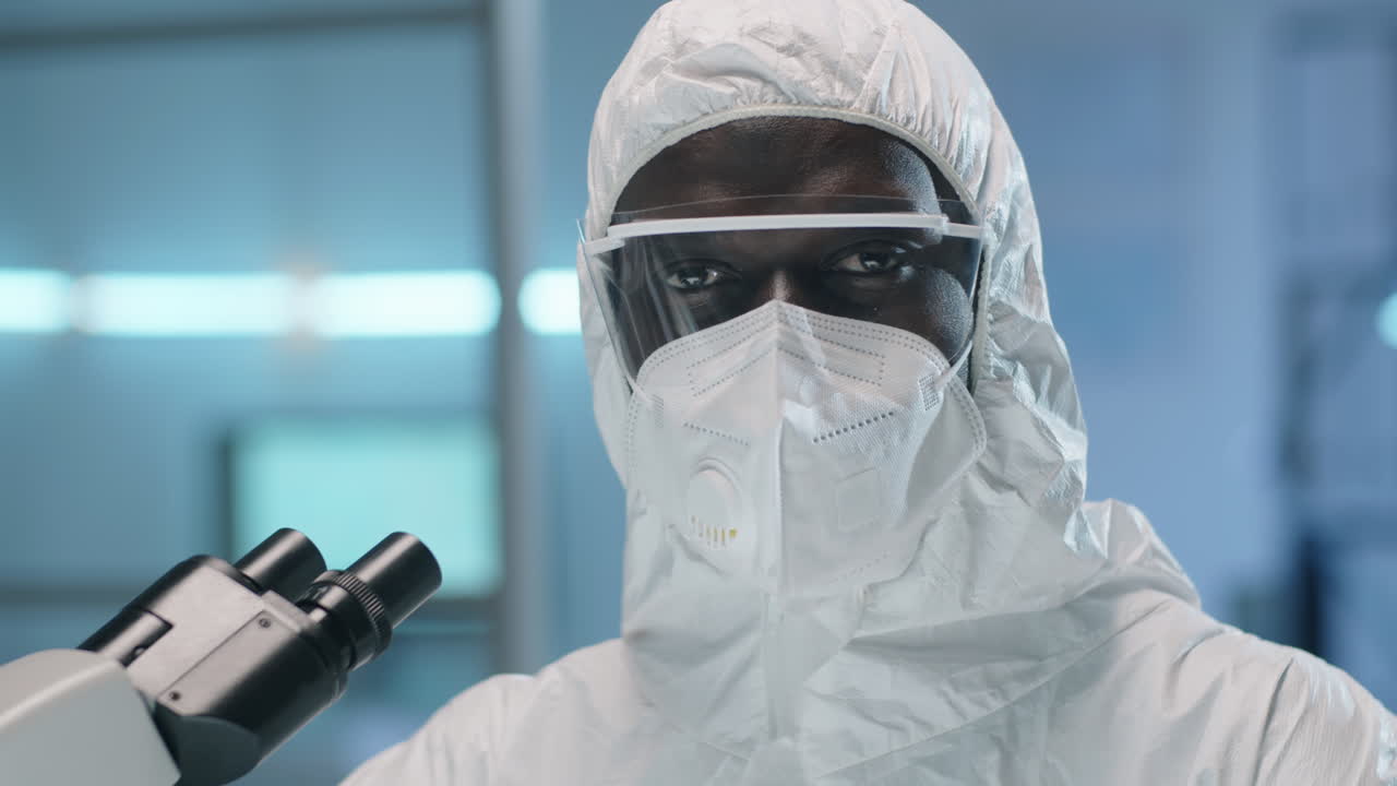Portrait of African American Lab Scientist in Protective Suit