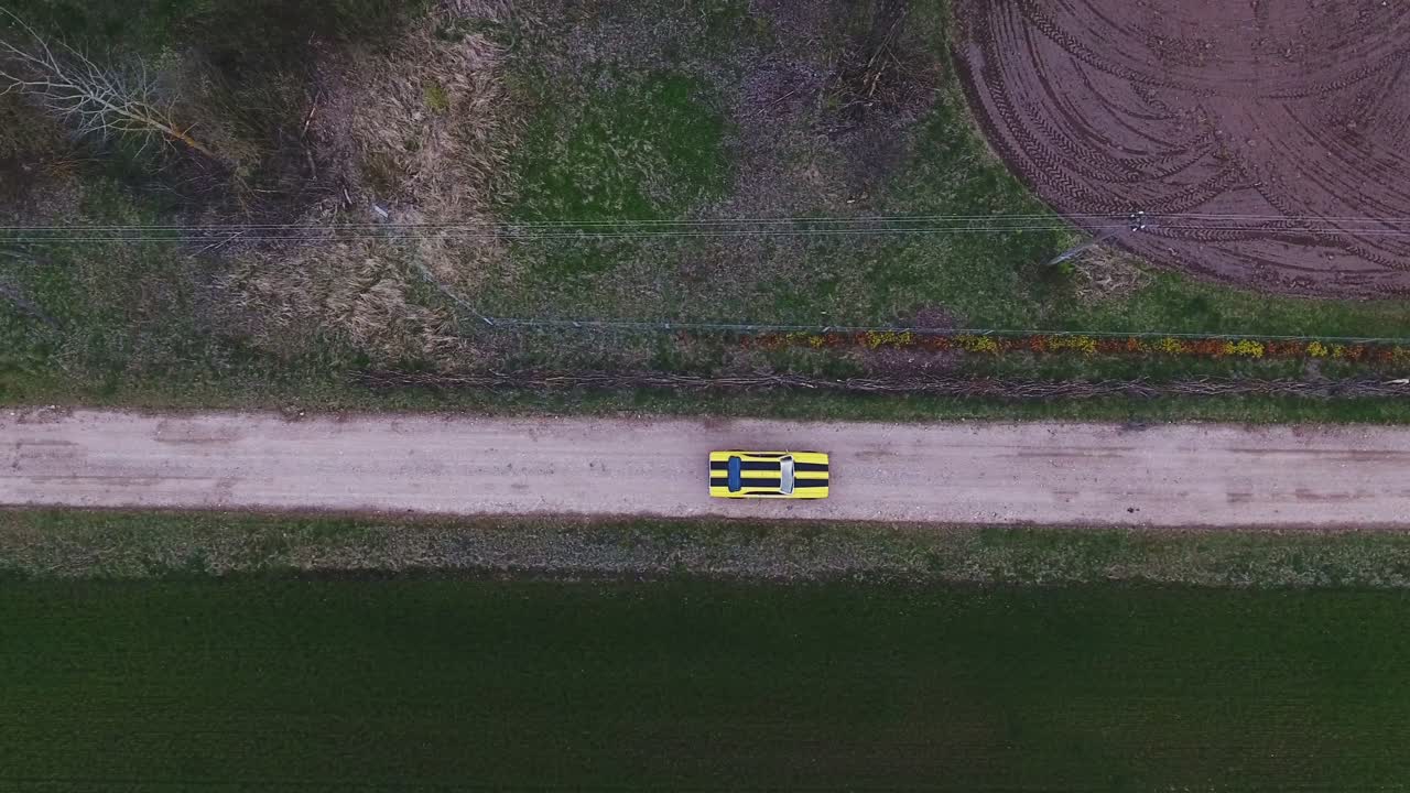 Yellow With Black Stripes Classic Ford Consul 1973. 4K Aerial Active-Track Footage