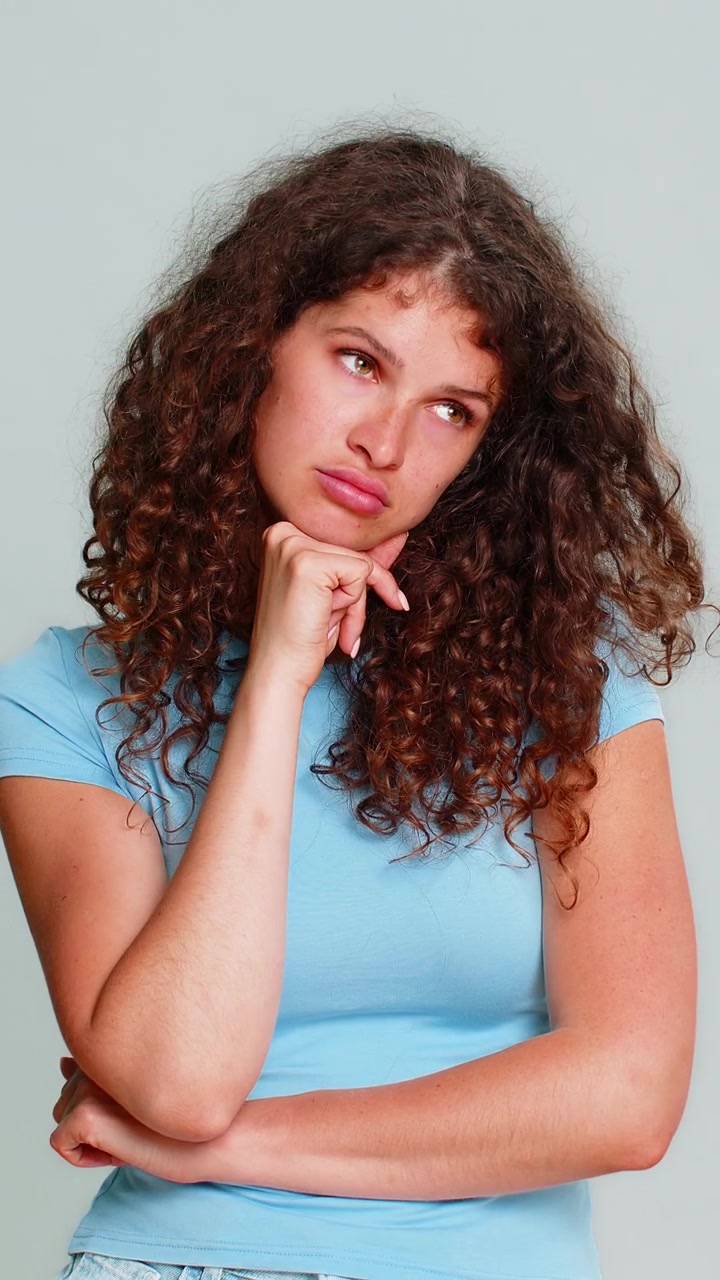 Young woman bored uninterested emotion indifferent face tired dull mood dissatisfied expression look