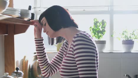 worried woman standing in kitchen 4k