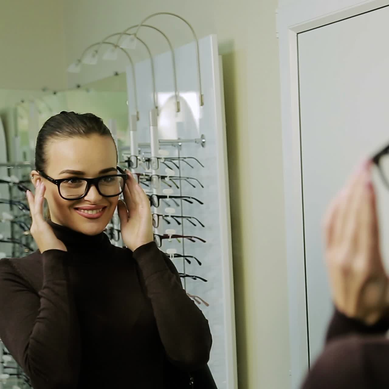 Woman choosing eyeglasses