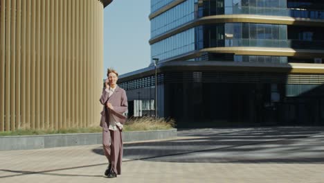 business woman talking on phone in city