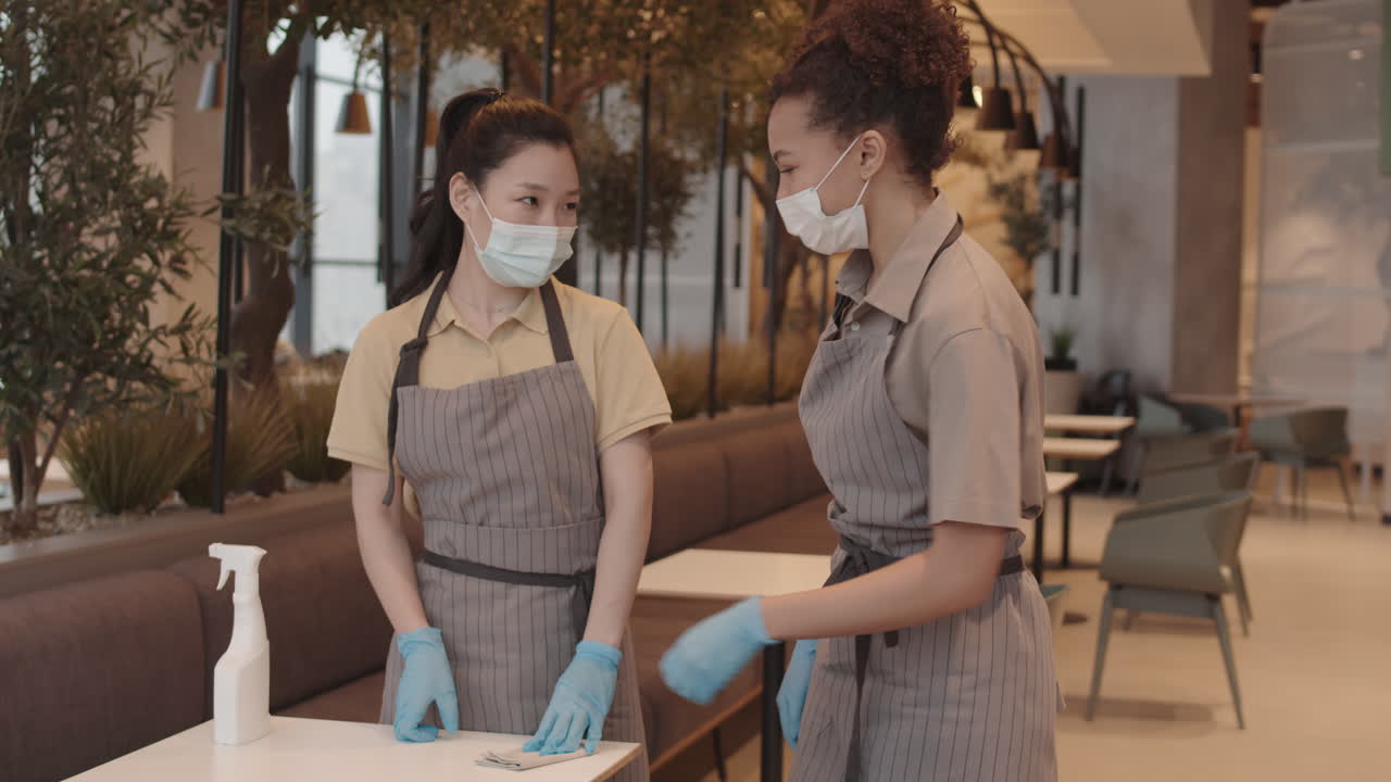 Waitresses in Masks Greeting and Cleaning Table