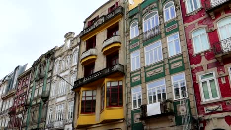 colorful facades of porto buildings in bolhao neighbourhood, pan right