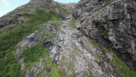 captivating fpv drone footage captures a scenic ascent along a tranquil stream in the stunning landscapes of norway