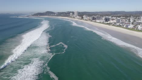 scenic ocean and coastal suburb at palm beach in the city of gold coast, queensland, australia - aerial drone shot