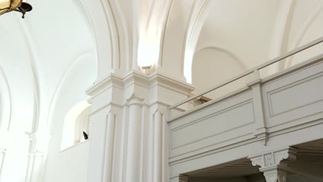 Architectural detail of columns, balcony inside Lutheran church in Europe