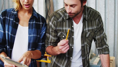 Two-beautiful-carpenter-having-a-discussion