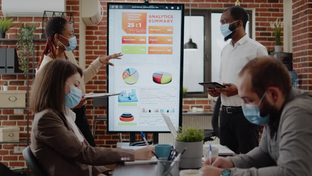 African american workmates presenting marketing strategy