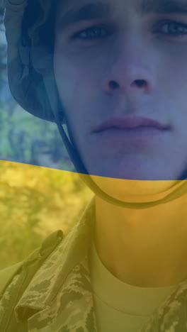 animation of flag of ukraine over caucasian male soldier with weapon