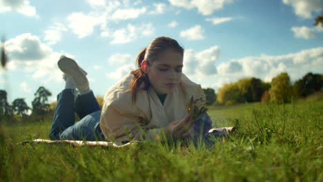 woman relaxing in autumn park