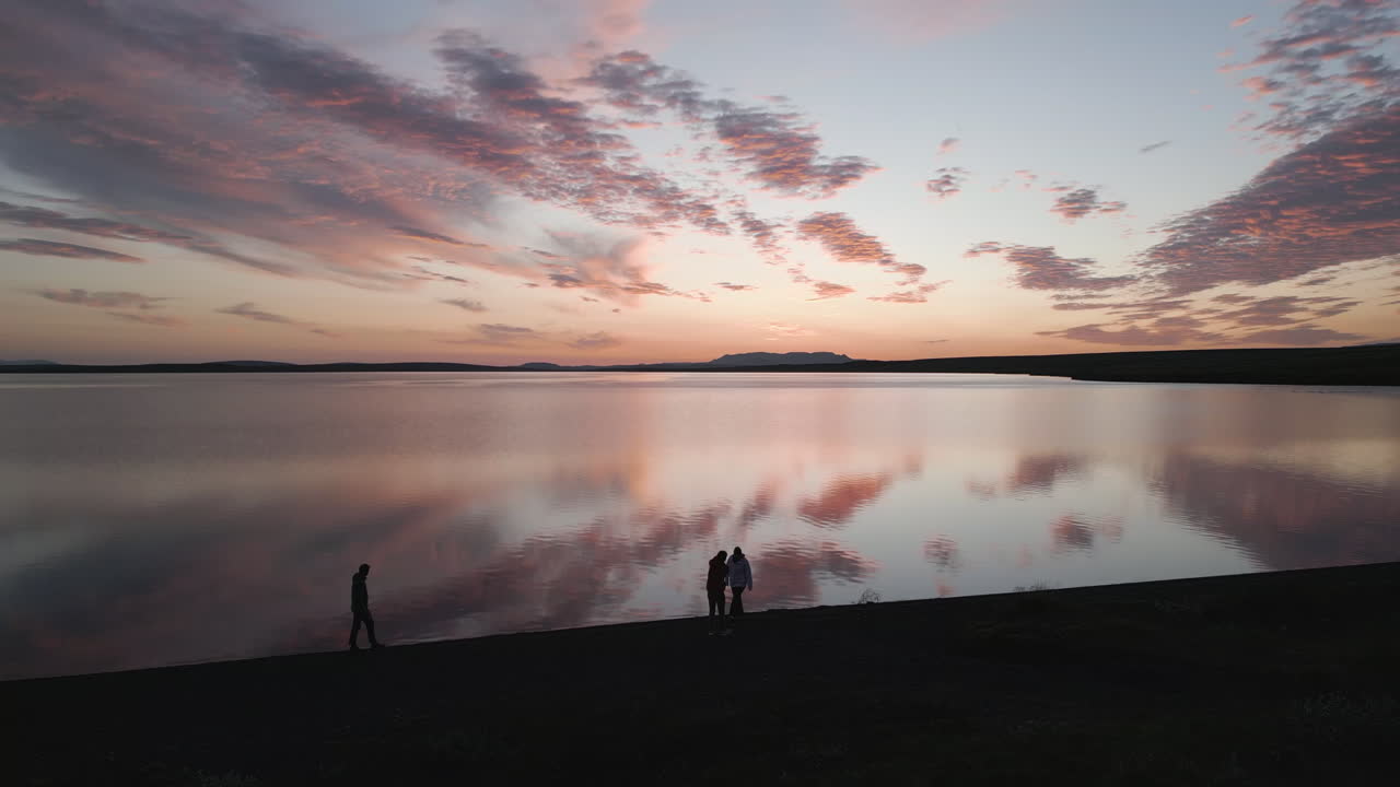 Icelandic lake at sunset under the midnight sun, serene and peaceful mood