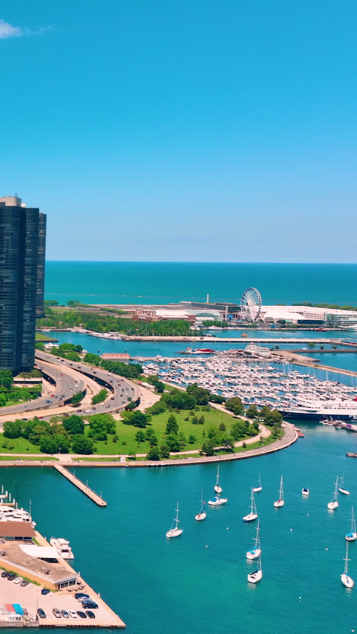 Centennial Wheel at Navy Pier. The new attraction and the Chicago skyline seen from Lake Michigan. Vertical video