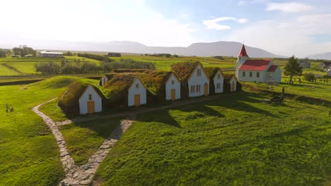 glide over the picturesque village of skagafjörður, capturing the essence of viking culture and the breathtaking scenery that surrounds it