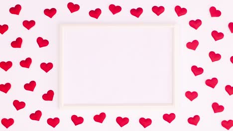 los corazones del día de san valentín se mueven alrededor del marco para el texto. detenga el movimiento
