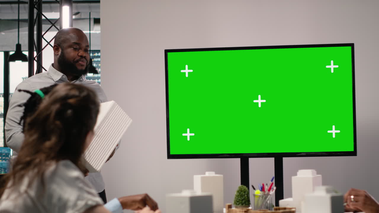 Business Meeting with Green Screen Display