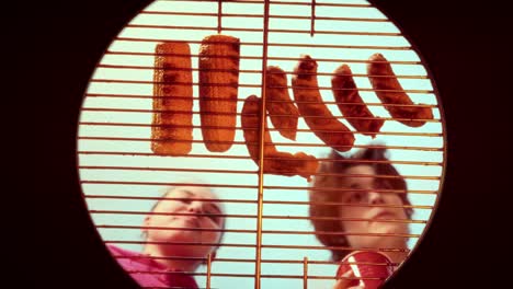 grilled corn and sausages on a barbecue