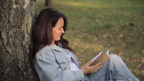 young woman reading book in park studying and prep 4k 2025 08 05 01 14 34 utc.mov | activity, atmosphere, autumn, book
