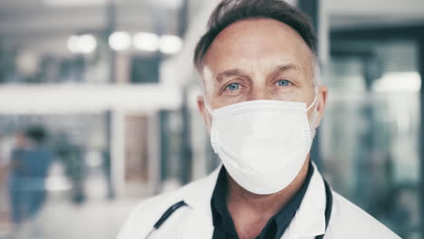a-mature-male-medical-doctor-wearing-a-facemask