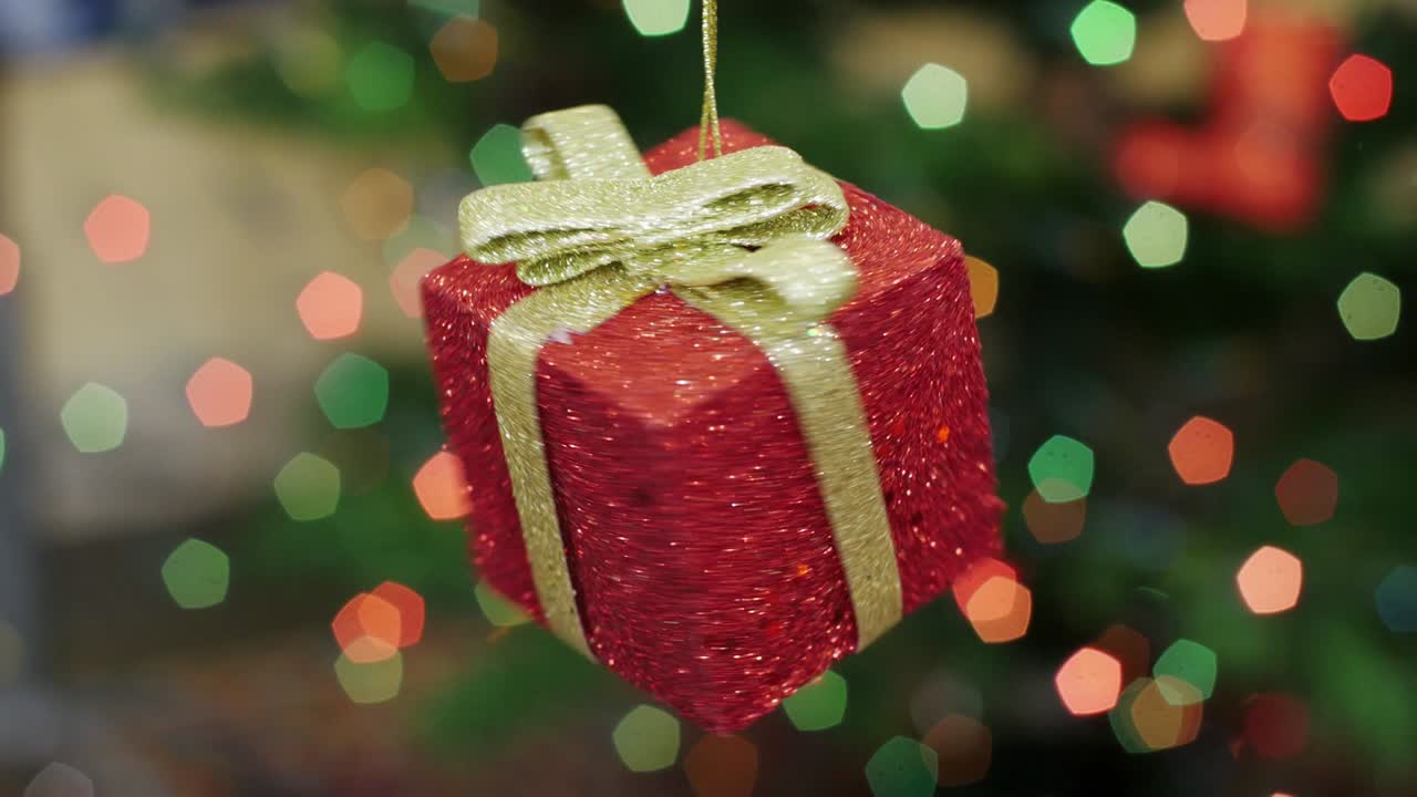 el juguete de regalo de navidad gira en el fondo bokeh