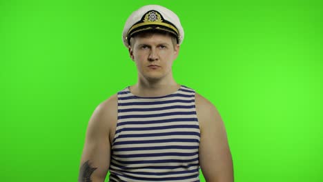 Young-sailor-man-arms-crossed,-looking-at-camera.-Seaman-guy-in-sailor's-vest