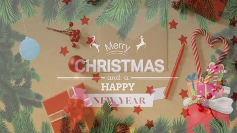 Animation-of-christmas-greetings-text-over-envelope,-christmas-presents-and-decorations