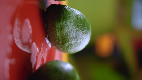 an avocado on a red cutting board gradually appears out of focus and into focus