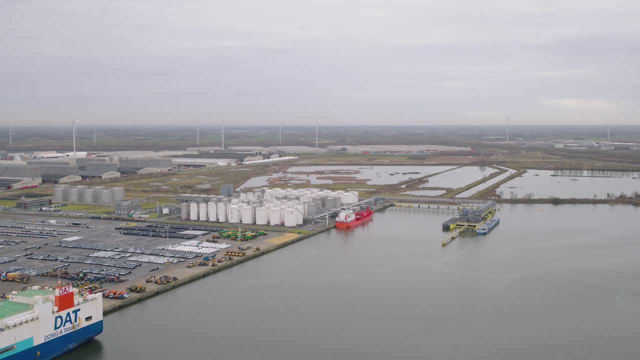 Cargo bay in port of Belgium city, aerial drone view
