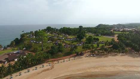 closing in aerial shot of a beach resort beach and villas in mermaids bay in southwest ivory coast san pedro africa