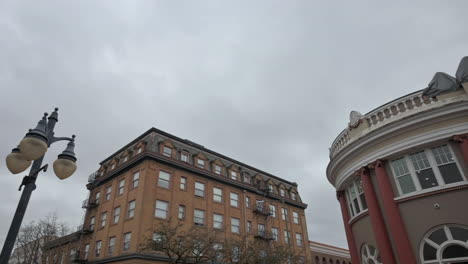 exterior details of old buildings in coos bay, oregon against dramatic sky