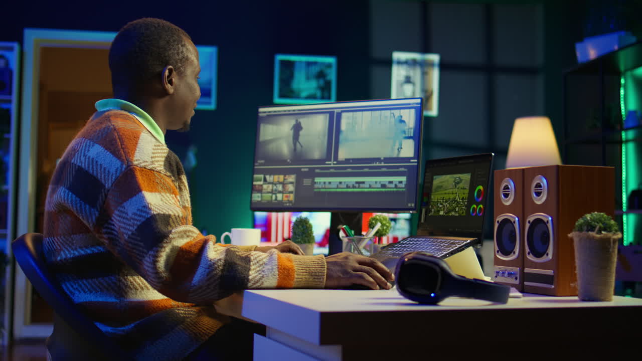 Man video editing on computer