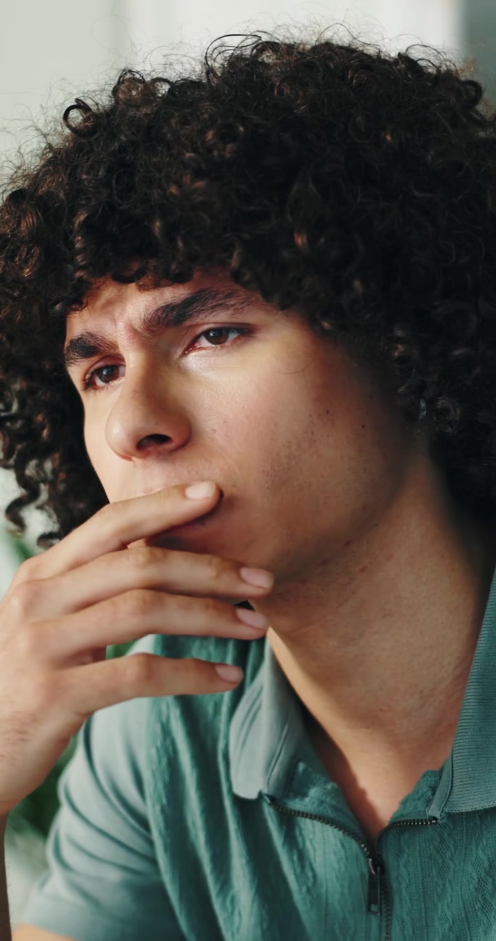 Young Man Suffering from Headache and Fatigue