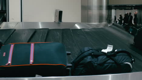 travel bags on the conveyor belt at airport