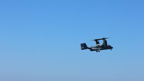 helicopter performing low flight over sea