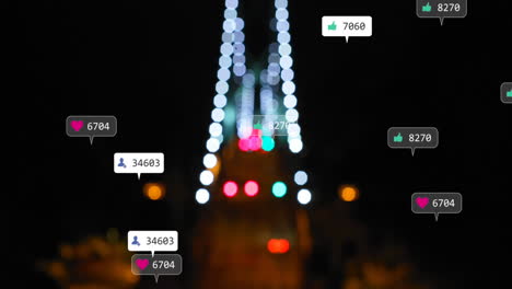 animation of social media icons and numbers over out of focus city and traffic lights