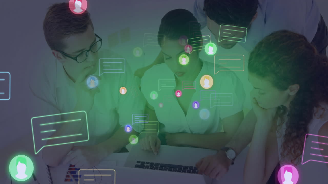 Collaborating on laptop, diverse team discussing animation in school setting