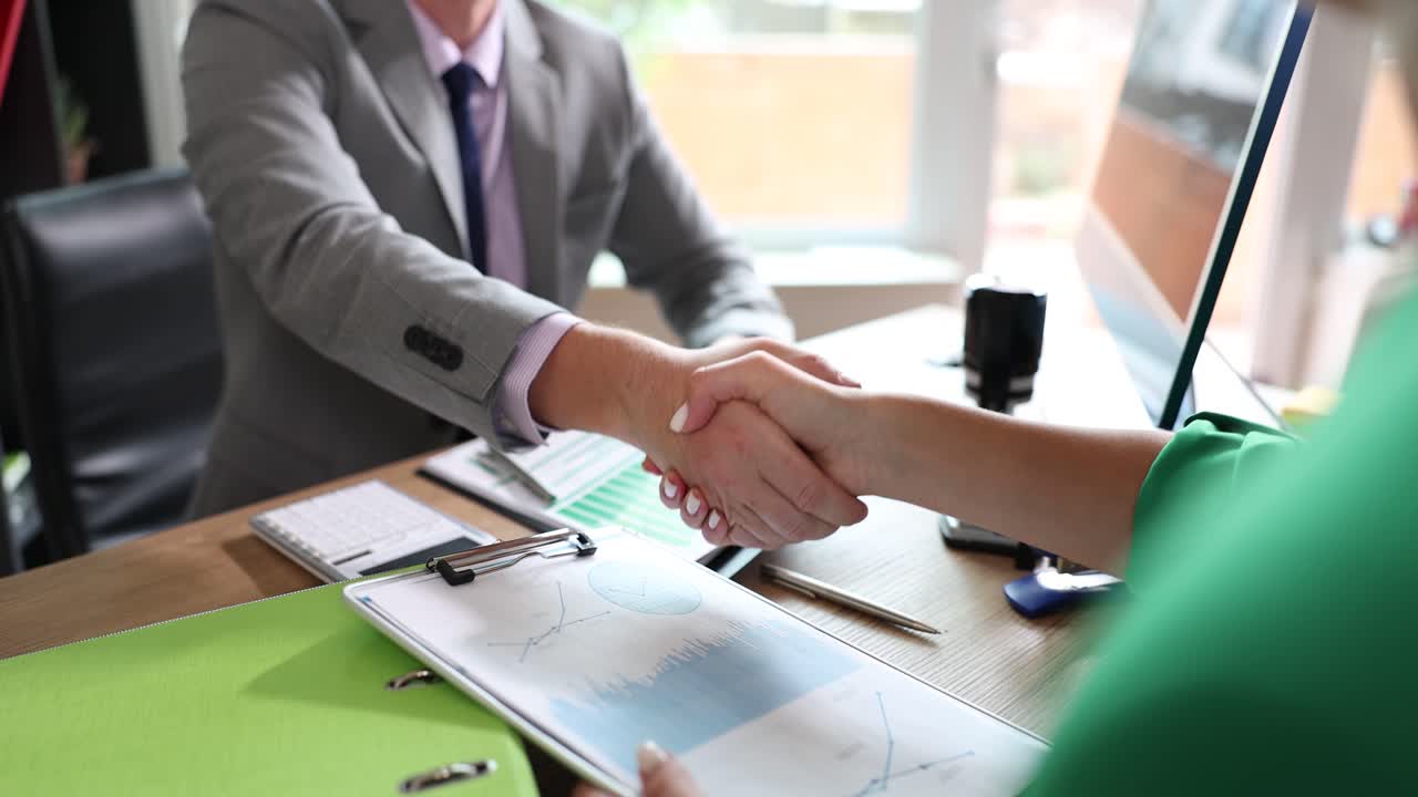 Business Handshake in Office Setting