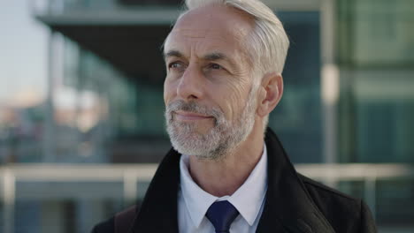 close up portrait of mature professional businessman drinking coffee enjoying outdoors