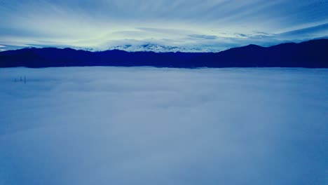 Aerial-Drone-Fly-Above-Heavenlike-Blue-Clouds,-Andean-Cordillera-Mountain-Range-of-Santiago-de-Chile-Cloudy-Sky