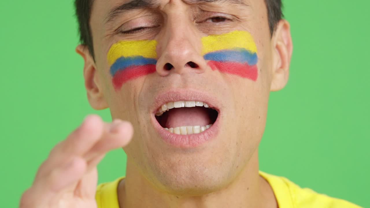 Very nervous man supporting colombian team during a difficult match
