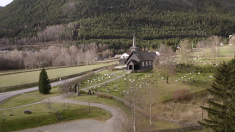 heidal church with gudbrand valley at background in sel, innlandet county, norway