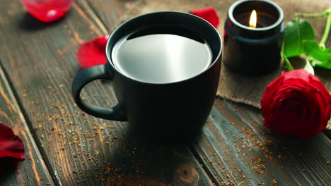 Mug-of-drink-and-red-roses