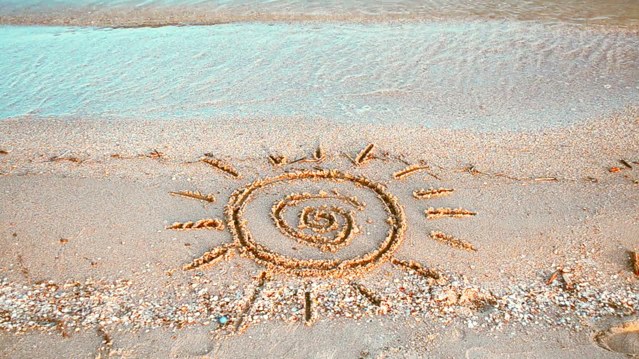 Sun drawing on the beach. Beach and drawing