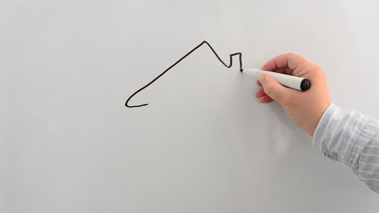 Dibujamos una casa en una pizarra con un marcador. Escribimos con un marcador
