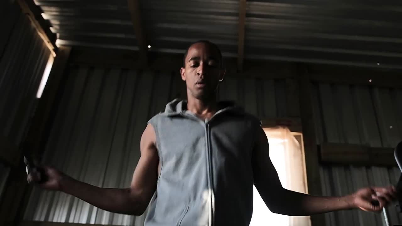 Boxer doing jump ropes in the gym